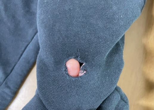 6 Spiritual Meanings of Dreaming of Holes in Clothes